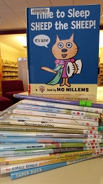 Photo of a stack of library picturebooks about sheep