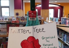 Photo of a sign asking for donations of mittens